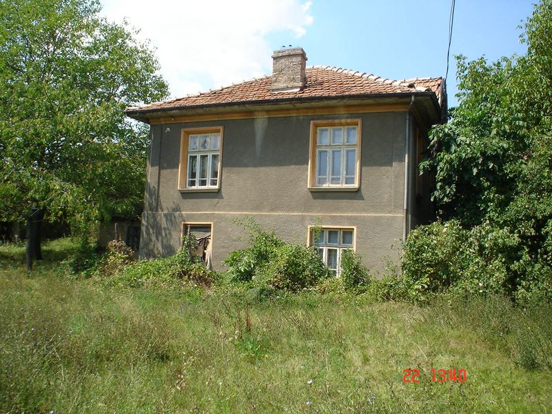 A village house with a large garden for sale